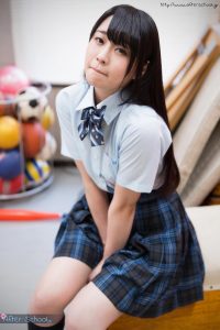 Seductive Japanese girl in schoolgirl uniform